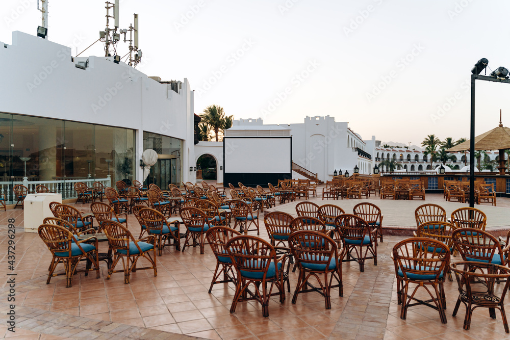 Summer outdoor stage. Summer terrace with tables and chairs, stage for performances and entertainment