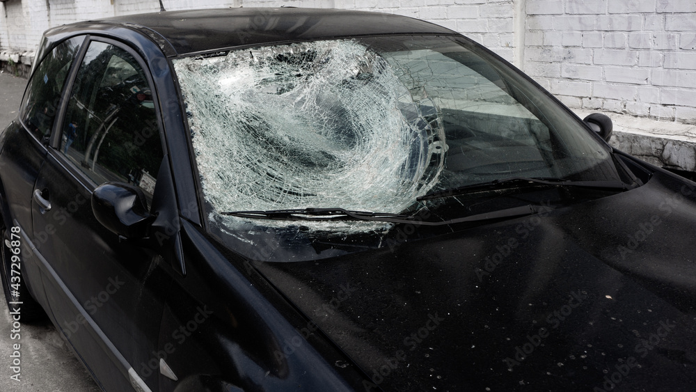 Broken windshield of a car after an accident