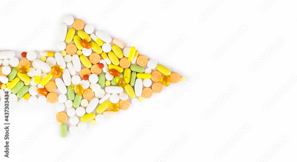 Arrow of multicolored pills on a white background with Copy space . concept of a healthy lifestyle and nutritional supplements and vitamins c and omega 3 acids. Flat lay Arrow of multicolored pills on a white background with Copy space . concept of a healthy lifestyle and nutritional supplements and vitamins c and omega 3 acids. Flat lay