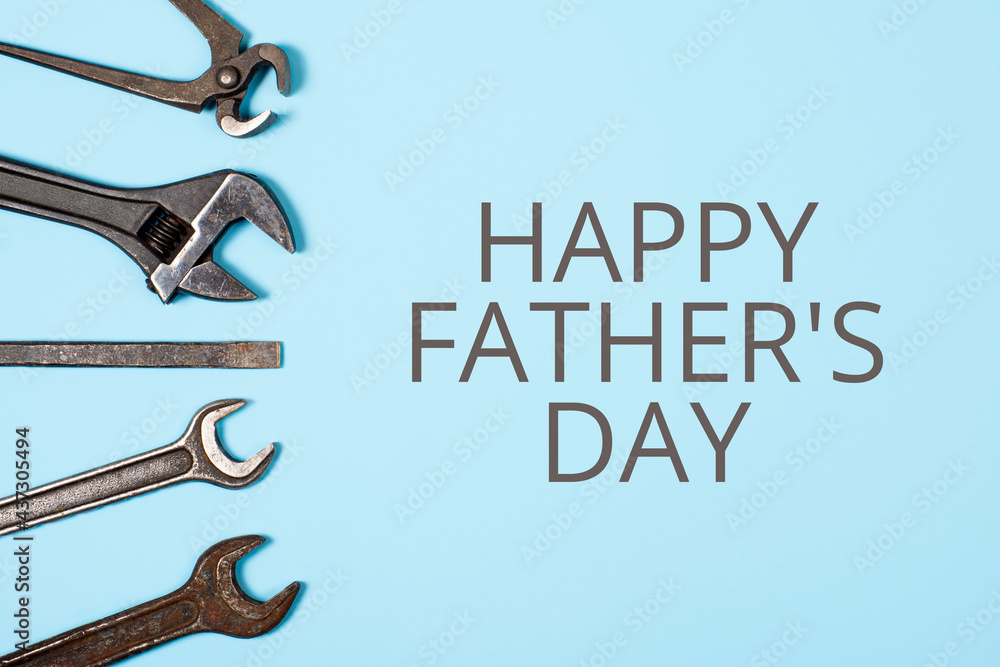 Happy father's day banner. Different wrenches on blue background.