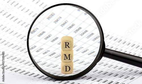 RMD wooden cubes on the chart background , look through magnifier photo