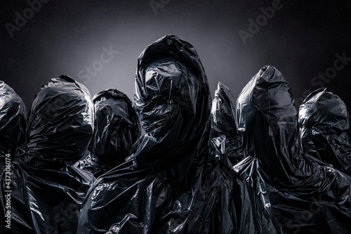 Fotografia Group of creepy figures over dark misty background