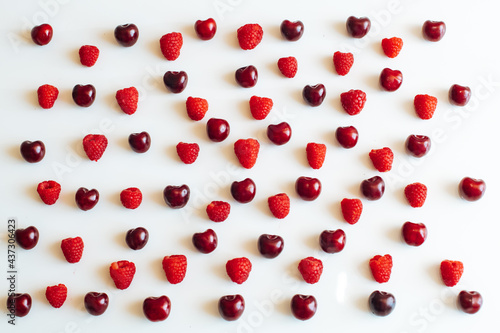 cherry and raspberry on a white background