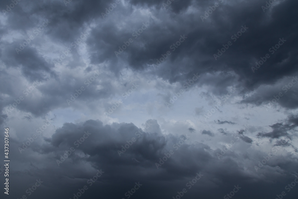 Epic storm sky with dark grey cumulus rainy clouds in the wind, background, texture, thunderstorm Epic storm sky with dark grey cumulus rainy clouds in the wind, background, texture, thunderstorm