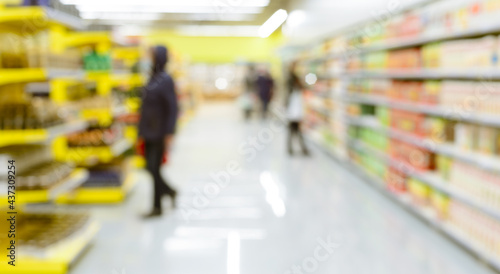 abstract defocused shoppers at supermarket