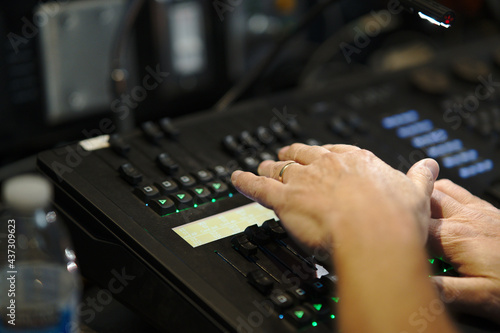 hands on a sound board © TLSolutions