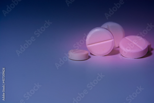 Pills on a colorful background. Medical theme.