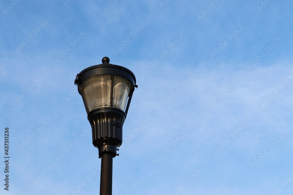 Lamp Light Against Blue Sky