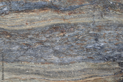 Wet Northeast seacoast blue gray Metamorphic and layered sedimentary rock iron formation top view