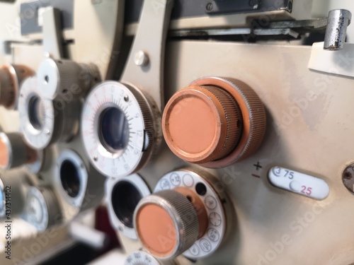 Closeup vintage ophthalmic microscope or Phoropter, Optical equipment for testing vision. Professional medical machine. Ophthalmology and Optometry.