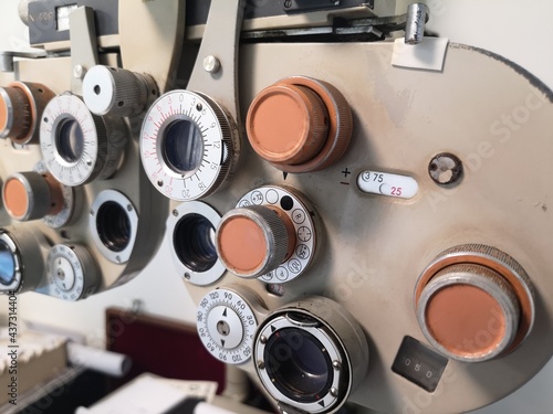 Closeup vintage ophthalmic microscope or Phoropter, Optical equipment for testing vision. Professional medical machine. Ophthalmology and Optometry.