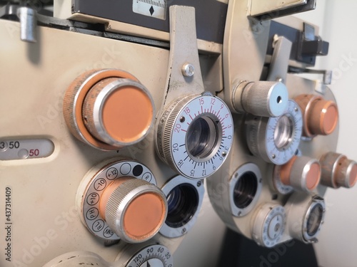 Closeup vintage ophthalmic microscope or Phoropter, Optical equipment for testing vision. Professional medical machine. Ophthalmology and Optometry.
