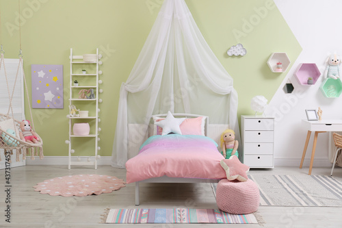 Cute child s room interior with toys and modern furniture