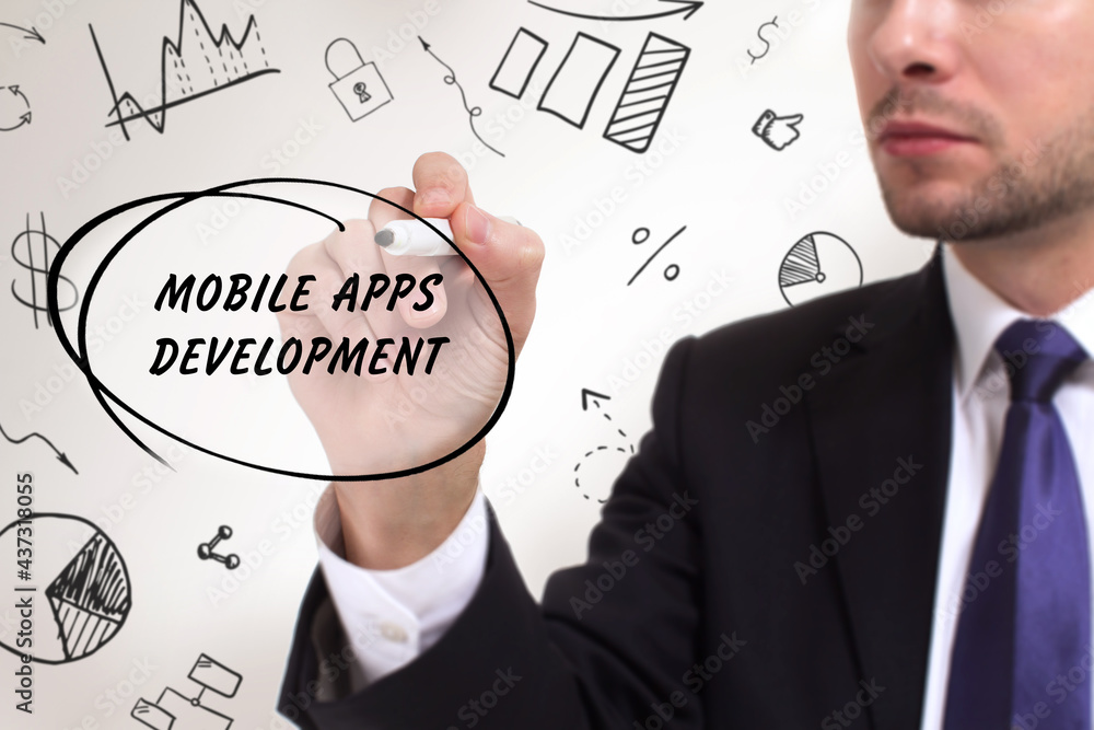 Business, technology, internet and network concept. Young businessman thinks over the steps for successful growth: Mobile apps development Business, technology, internet and network concept. Young businessman thinks over the steps for successful growth: Mobile apps development