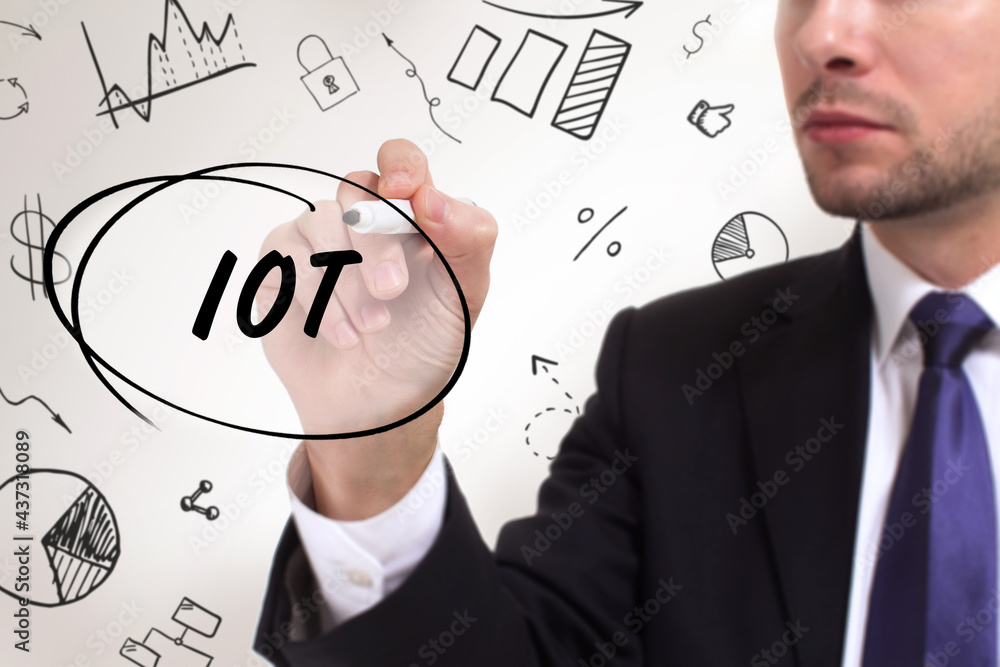 Business, technology, internet and network concept. Young businessman thinks over the steps for successful growth: IOT Business, technology, internet and network concept. Young businessman thinks over the steps for successful growth: IOT