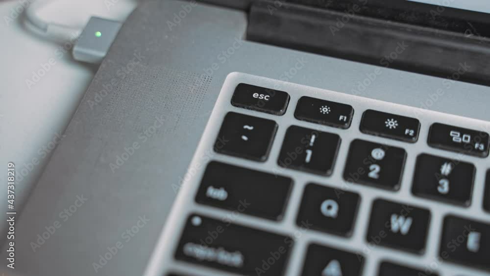 Hand clicking esc button on laptop keyboard for multiple times. Trying to cancel something Hand clicking esc button on laptop keyboard for multiple times. Trying to cancel something