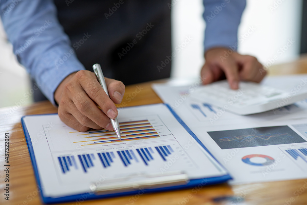 Financial Businessman analyze the graph of the company's performance to create profits and growth, Market research reports and income statistics, Financial and Accounting concept. Financial Businessman analyze the graph of the company's performance to create profits and growth, Market research reports and income statistics, Financial and Accounting concept.