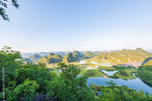 Sunny morning scenery in Puzhehei, Yunnan, China photo