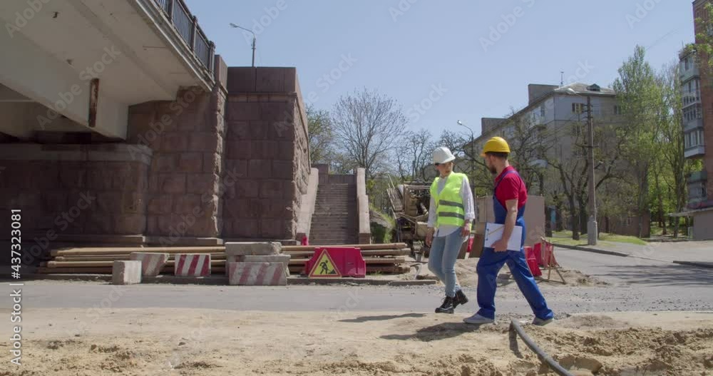 Builder and engineer at construction site Builder and engineer at construction site