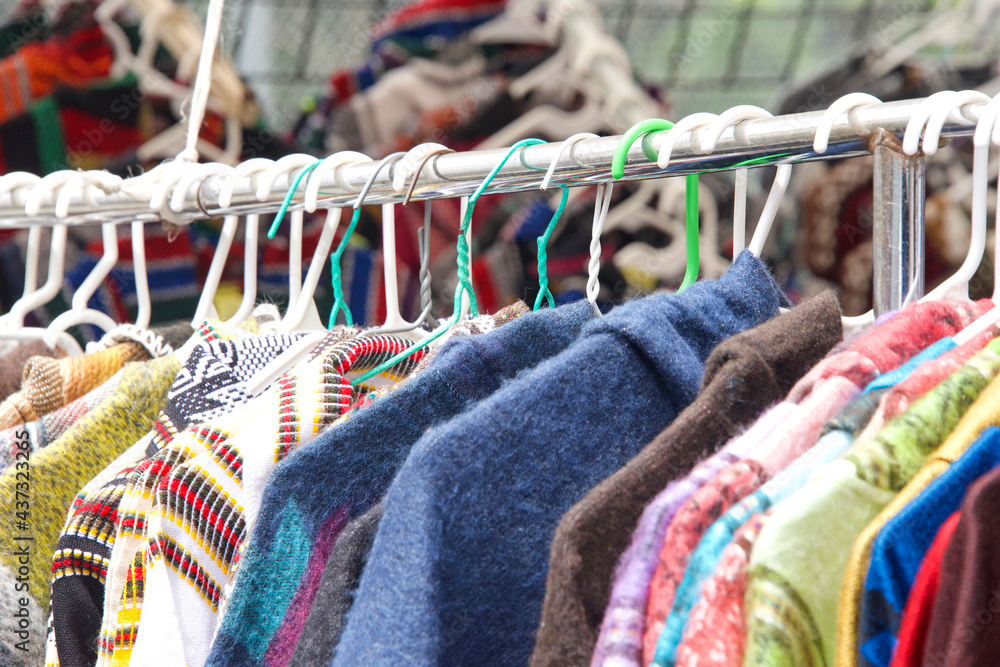 Ταπετσαρία close up of clothing hanging on a rack at resale shop at street fair outside