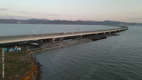 Wallpaper Mural Aerial forward Vladivostok costal cityscaspe low-water bridge across blue sea. Torontodigital.ca