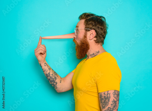 Man has a long nose because he said a lot of lie photo