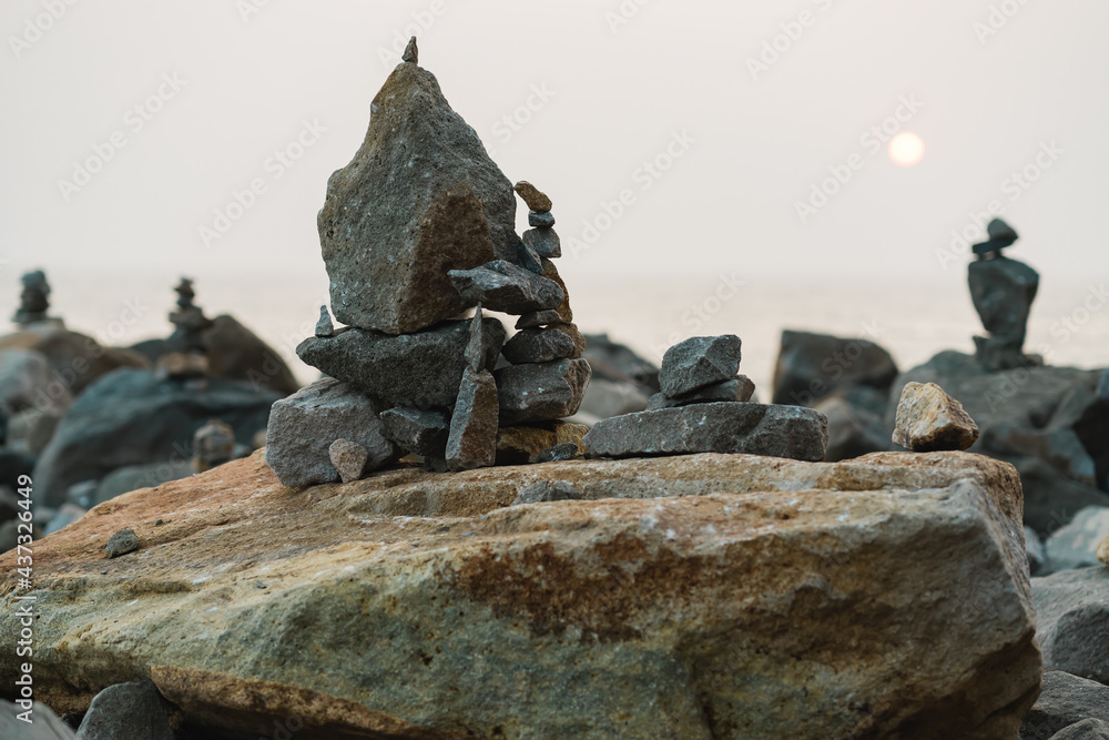 Rocks on the beach at sunset. Balance and harmony concept Rocks on the beach at sunset. Balance and harmony concept