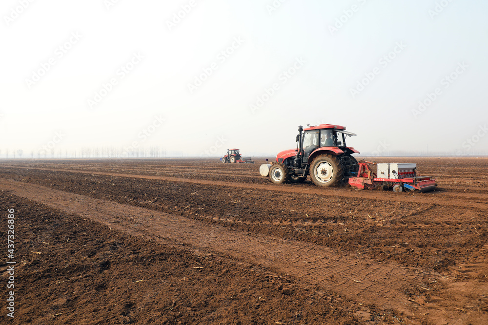 Farmers drive planters to grow peas on the farm Farmers drive planters to grow peas on the farm