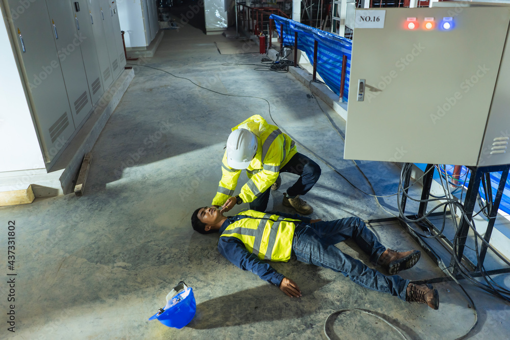 Asian electrician worker accident electric shock unconscious in site work. Supervisor first aid maintenance worker accident electric shock unconscious. - obrazy, fototapety, plakaty 