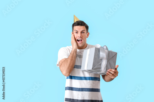 Surprised handsome man with...