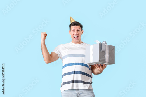 Happy handsome man celebrat...
