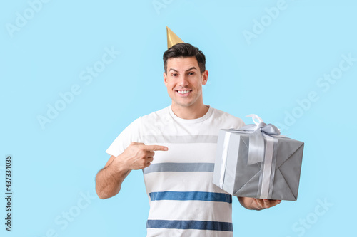 Happy handsome man pointing...