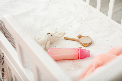 Baby crib with pink bottle ...