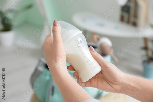 Woman with bottle of milk f...