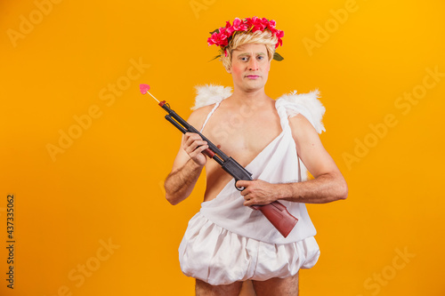 cupid holding a Bigger Shotgun, Ancient Weapon, Love Gunpowder. armed cupid photo