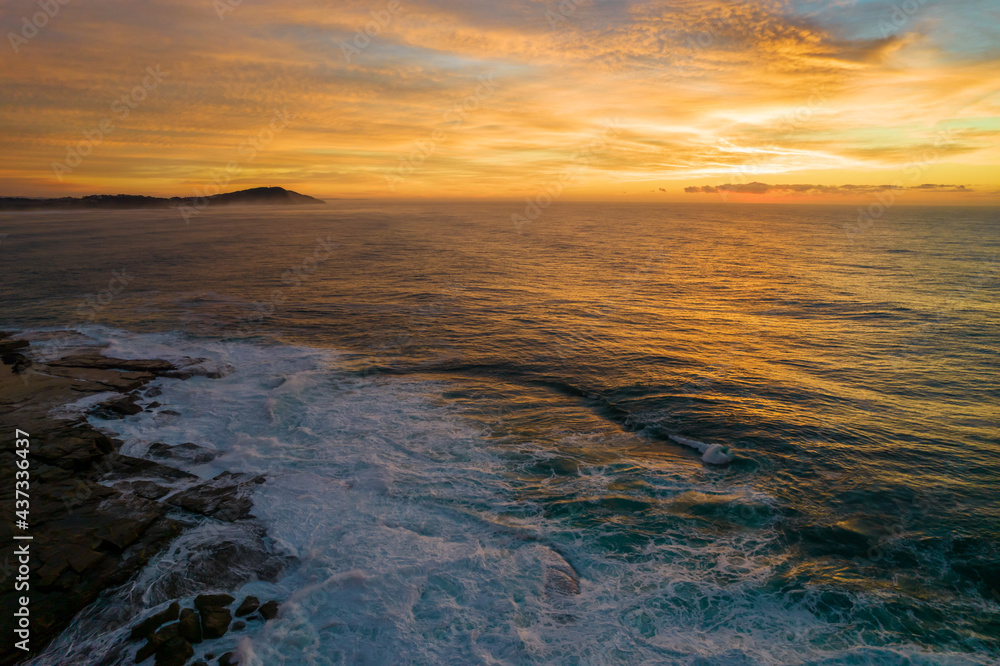 Aerial Sunrise Seascape at Rocky Inlet with colourful high cloud