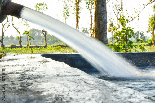 water is flowing through a pipe in agriculture land