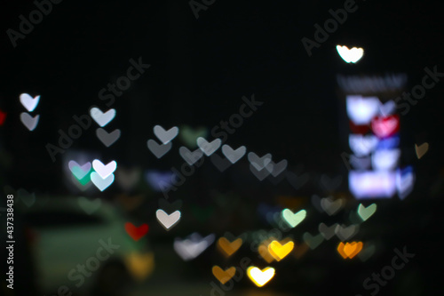 Fototapeta Naklejka Na Ścianę i Meble -  rainbow and blur heart shape love valentine day colorful night light on street