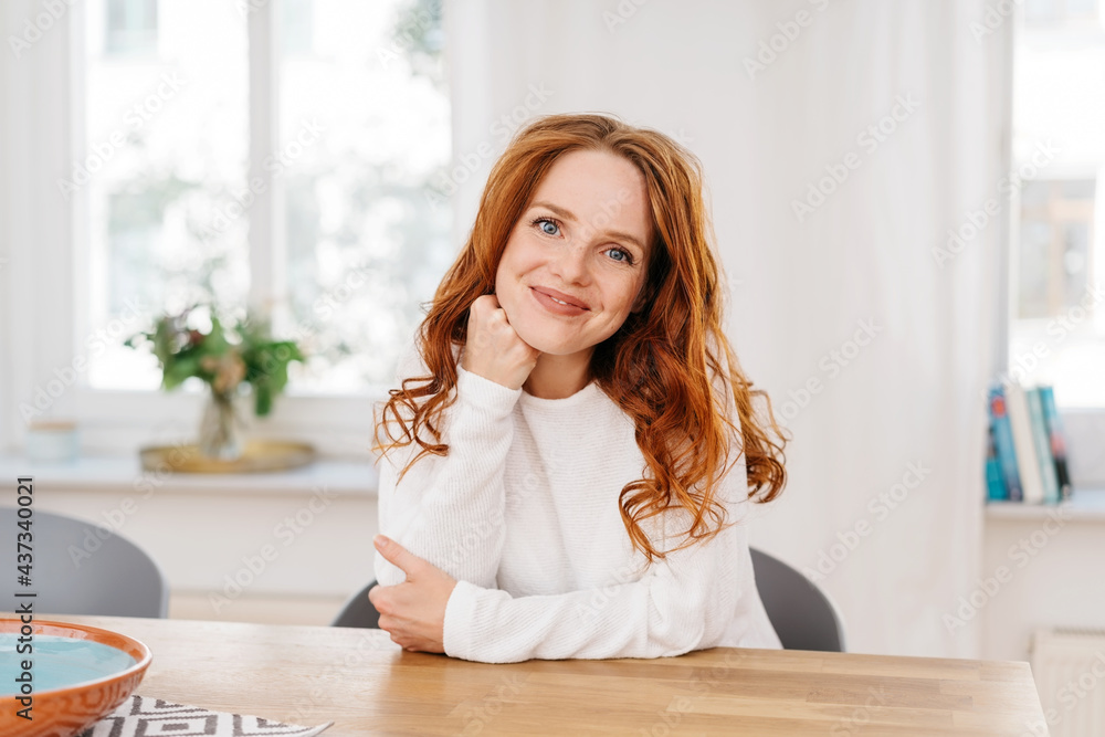 Cute young redhead woman with a sweet friendly smile Cute young redhead woman with a sweet friendly smile