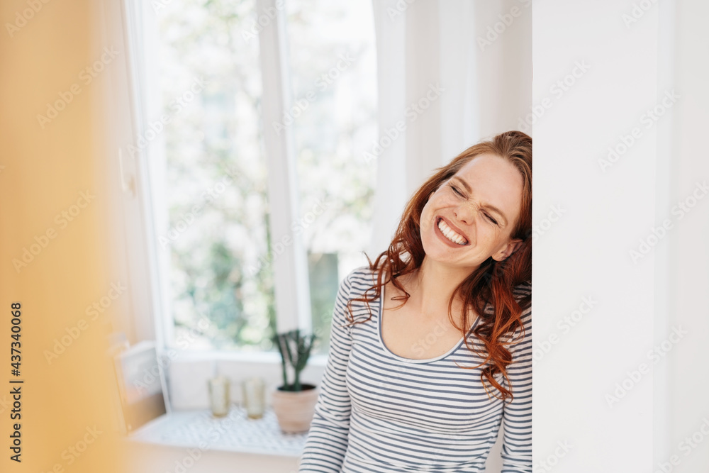 Cute candid portrait of a grinning young redhead woman Cute candid portrait of a grinning young redhead woman