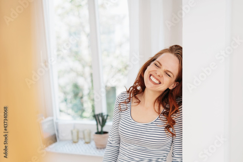 Cute candid portrait of a grinning young redhead woman Free Download Cute candid portrait of a grinning young redhead woman - GFXLoad