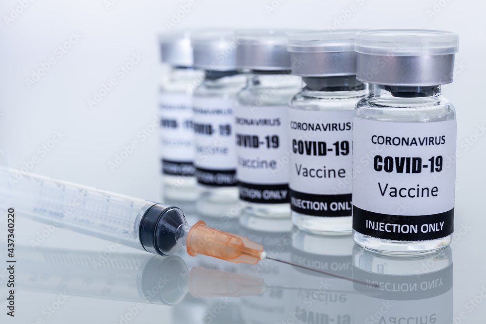 Many Vaccine bottles and syringes for preventing coronavirus or covid-19. Select focus Many Vaccine bottles and syringes for preventing coronavirus or covid-19. Select focus