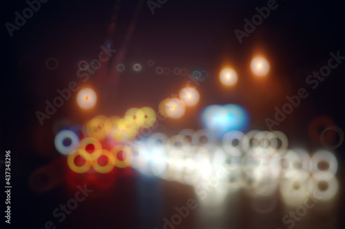 abstract blurred view of the night city from a car window, traffic in the city © kichigin19