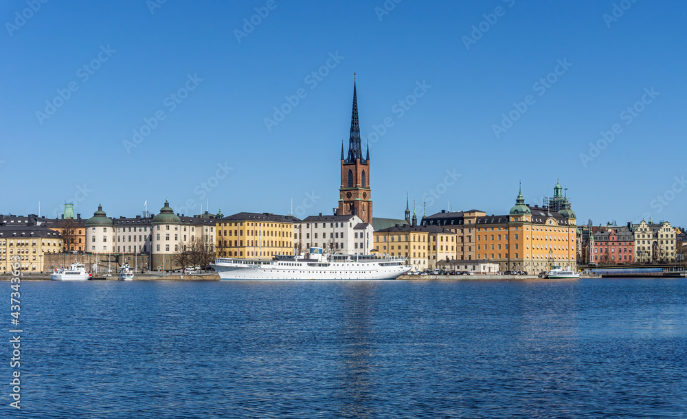 One of the islands in center of Stockholm with historical buildings on sunny day