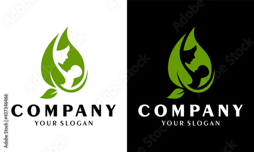 Leaf and mother taking care of baby logo. Colorful beautiful mother holding baby on abstract leaf background