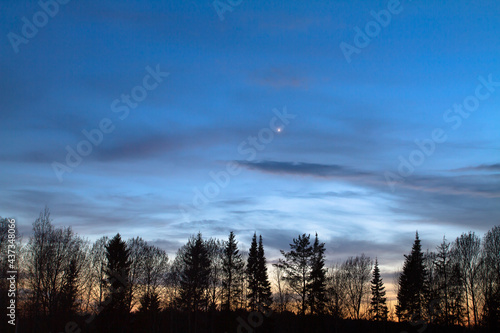 the planet Venus shines in the evening sky
