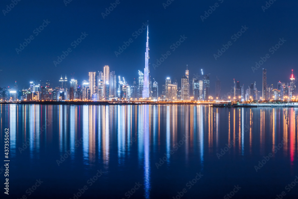 Panoramic view of the Burj Khalifa and other skyscrapers in the financial center of Dubai in the UAE with reflections in the waters of the Creek Channel Panoramic view of the Burj Khalifa and other skyscrapers in the financial center of Dubai in the UAE with reflections in the waters of the Creek Channel
