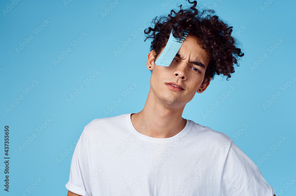 guy with curly hair comb in hair emotions lifestyle close up guy with curly hair comb in hair emotions lifestyle close up