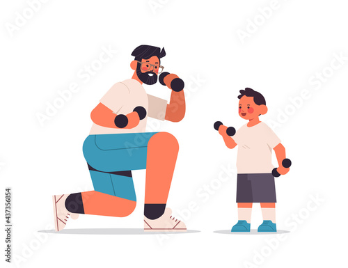 young father and son doing physical exercises with dumbbells parenting fatherhood concept