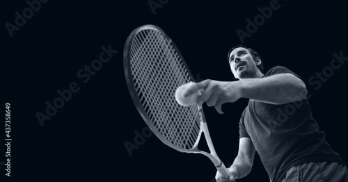 Compostion of male tennis player on black background © vectorfusionart